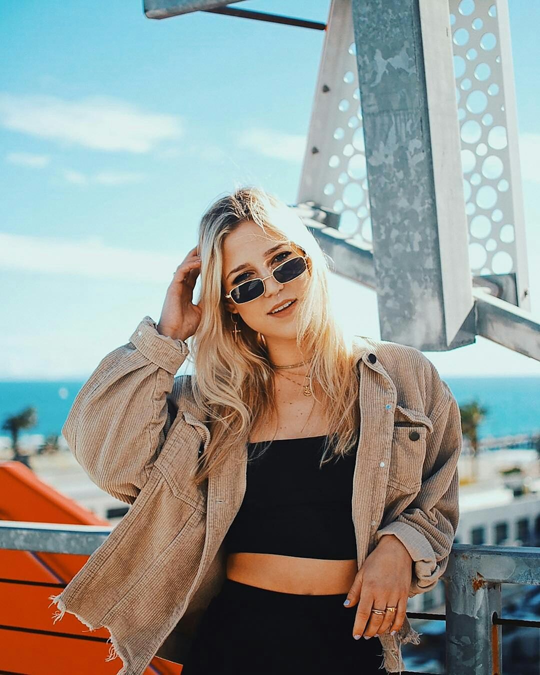 social media influencer posing in trendy outfit