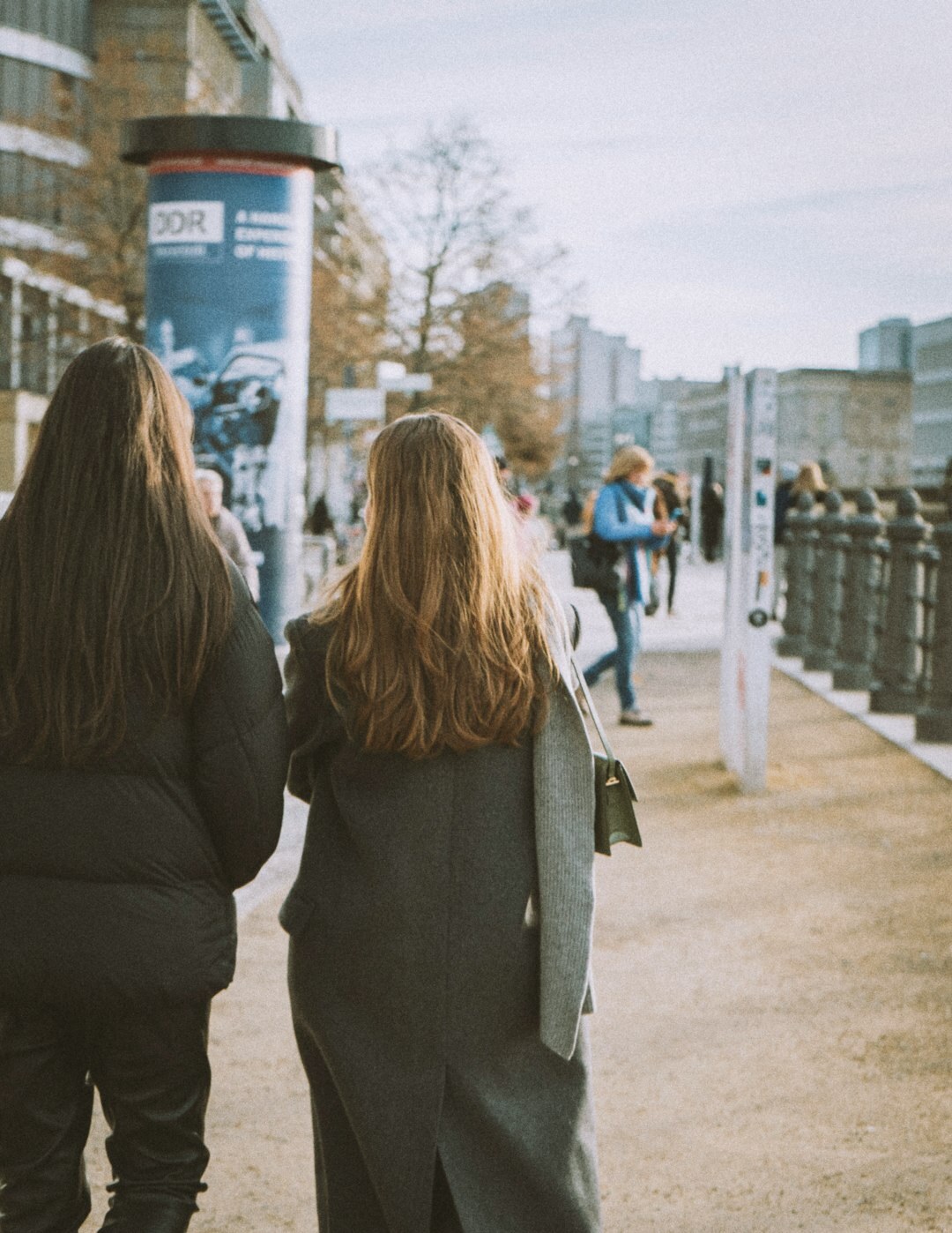 Two German professional women discussing research notes together